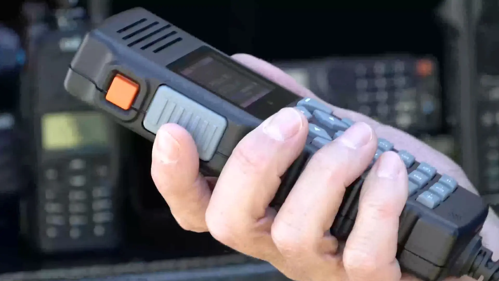 Close-up of a SmartPatch handheld controller used to manage multiple communication networks from one device. 