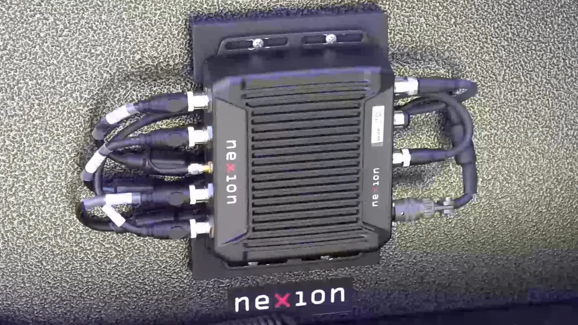Nexion SmartPatch unit installed in vehicle boot linking multiple radio and data networks 